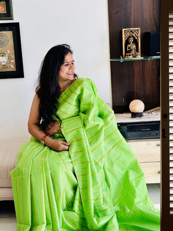 Sequin pallu detail on parrot green Tussar silk saree