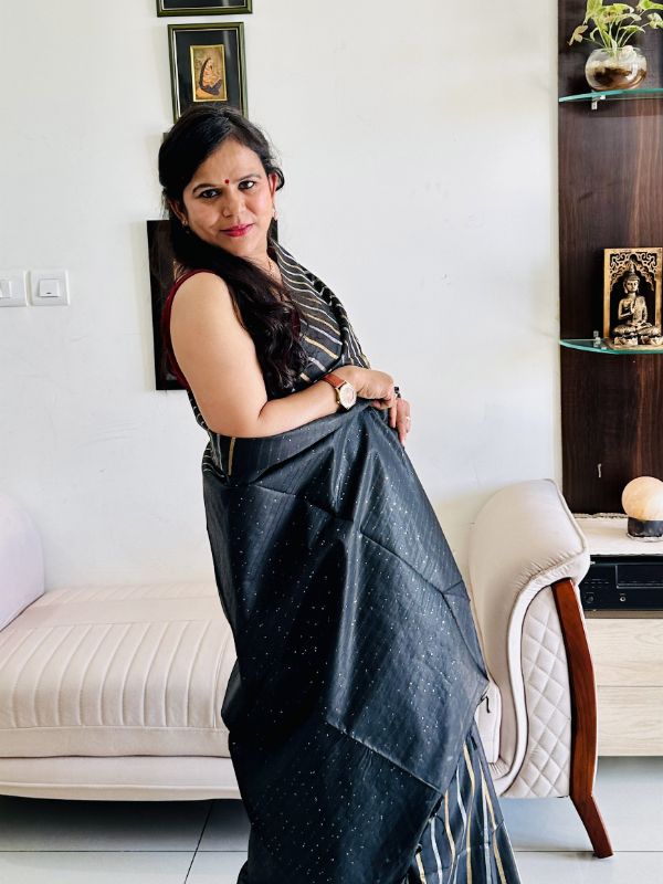 Gold and silver zari detailing on black Tussar silk saree